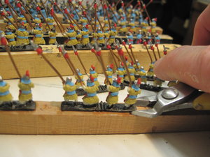 Cutting the strips from the painting supports